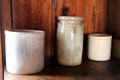 Stoneware crocks in Walton-Smith log cabin at Pioneer Museum. Fredericksburg, TX.