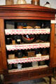 Shelving unit with embroidered German sayings in Kammlah kitchen at Pioneer Museum. Fredericksburg, TX.