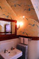 Bathroom with gull design wallpaper on third floor at McFaddin-Ward House. Beaumont, TX.