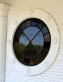 Decorative round window on carriage house at McFaddin-Ward House. Beaumont, TX.