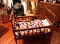 Cradle with quilt at Earle-Napier-Kinnard House. Waco, TX.