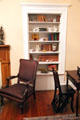 Bookcase with Ben Franklin library chair convertible to step ladder at Earle-Napier-Kinnard House. Waco, TX.