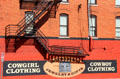Shop signs & fire escape in Fort Worth Stock Yards historic district. Fort Worth, TX.
