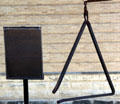 The "Old Triangle" on Courthouse Square used to summon firemen to a blaze. San Marcos, TX.
