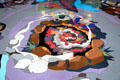 Campfire center of Story of Texas terrazzo mosaic by Robert T. Ritter at Bullock Texas State History Museum. Austin, TX.