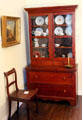 Tiger walnut secretary by John Wilhelm August Kline with walnut plank seat side chair by Johann Jahn at Museum of Texas Handmade Furniture. New Braunfels, TX.