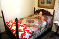 Walnut poster bed attrib. Johann Jahn with Civil War era quilt in "log cabin" pattern at Museum of Texas Handmade Furniture. New Braunfels, TX.