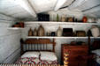 Interior of Mormon pioneer log home at Mormon Museum. Salt Lake City, UT.