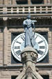 Statue of commerce in front of clock on tower of Salt Lake City & County Building. Salt Lake City, UT.