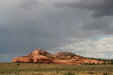 Rocks project above plain along Highway US191 south of Moab. UT.