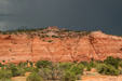 Rock striations above scrub along Highway US191 south of Moab. UT.