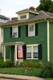 Green wooded house at City Point Square. Hopewell, VA.