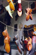 Wares hanging in window of Shoemaker's Shop. Williamsburg, VA.