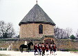 Soldiers parade in front of the octagonal magazine & arsenal. Williamsburg, VA.