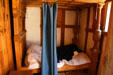 Covered bed inside governor's house in Fort James at Jamestown Settlement. Jamestown, VA.