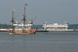 Godspeed passes modern ferry boats off Jamestown Settlement. Jamestown, VA.