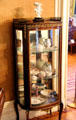 Vitrine with porcelain in ladies parlor at Park-McCullough Historic Estate. North Bennington, VT.