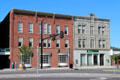 Heritage buildings facing city park including stone Granite Block. Barre, VT.