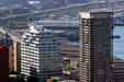 Highrise apartments against Seattle's waterfront peers from Space Needle. Seattle, WA.