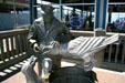 Statue of Ivar Feeding Gulls outside seafood fish bar he started. Seattle, WA.