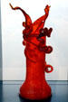 Red vase with curls glass sculpture by Dale Chihuly in Venetian Wall. Tacoma, WA.