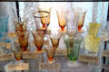 Amber & green etched footed glasses at Fostoria Glass Museum. Moundsville, WV.