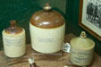 Collection of stoneware jugs from Pueblo, CO, at Nelson Museum of the West. Cheyenne, WY.