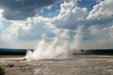 Geyser steam under cumulus clouds at Yellowstone National Park. WY.