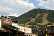 Frontier style buildings of Jackson against surrounding hills. Jackson, WY.