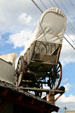 Covered wagon used as sign on Jackson Hole Museum. Jackson, WY.