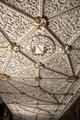 Highly ornate ceiling with panels filled with sculpted plaster figures of beasts & gilded elements in Library at Penrhyn Castle. Bangor, Wales.