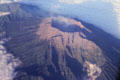 Smoking volcano near the eastern end of Java seen from the air. Indonesia