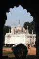Looking through an arch at one of palace buildings in Red Fort. Delhi, India.