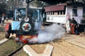 Steam monorail designed to run on one steel rail while balancing wheel ran on flanking public road in operation in Delhi rail museum. Delhi, India.
