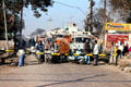 Traffic stops at a rail crossing on road to Mandawa. India.