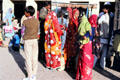 Women wearing brightly colored winter saris. Mandawa, India.